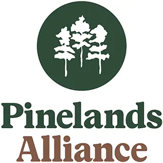 Pinelands Alliance logo. Pine Trees on a green field with Pinelands Alliance