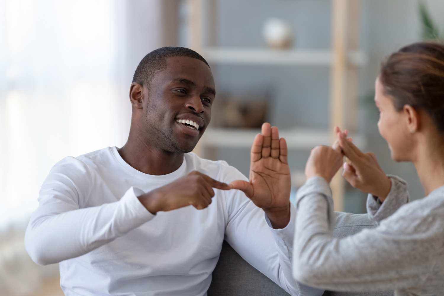 Two people using sign language