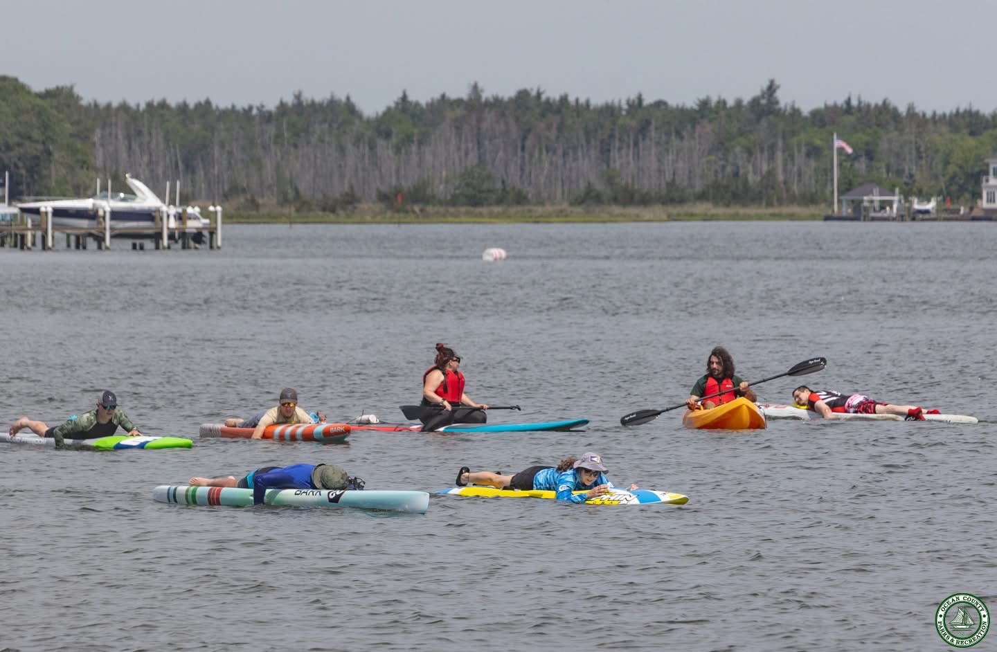 people using paddle boards and kayaks