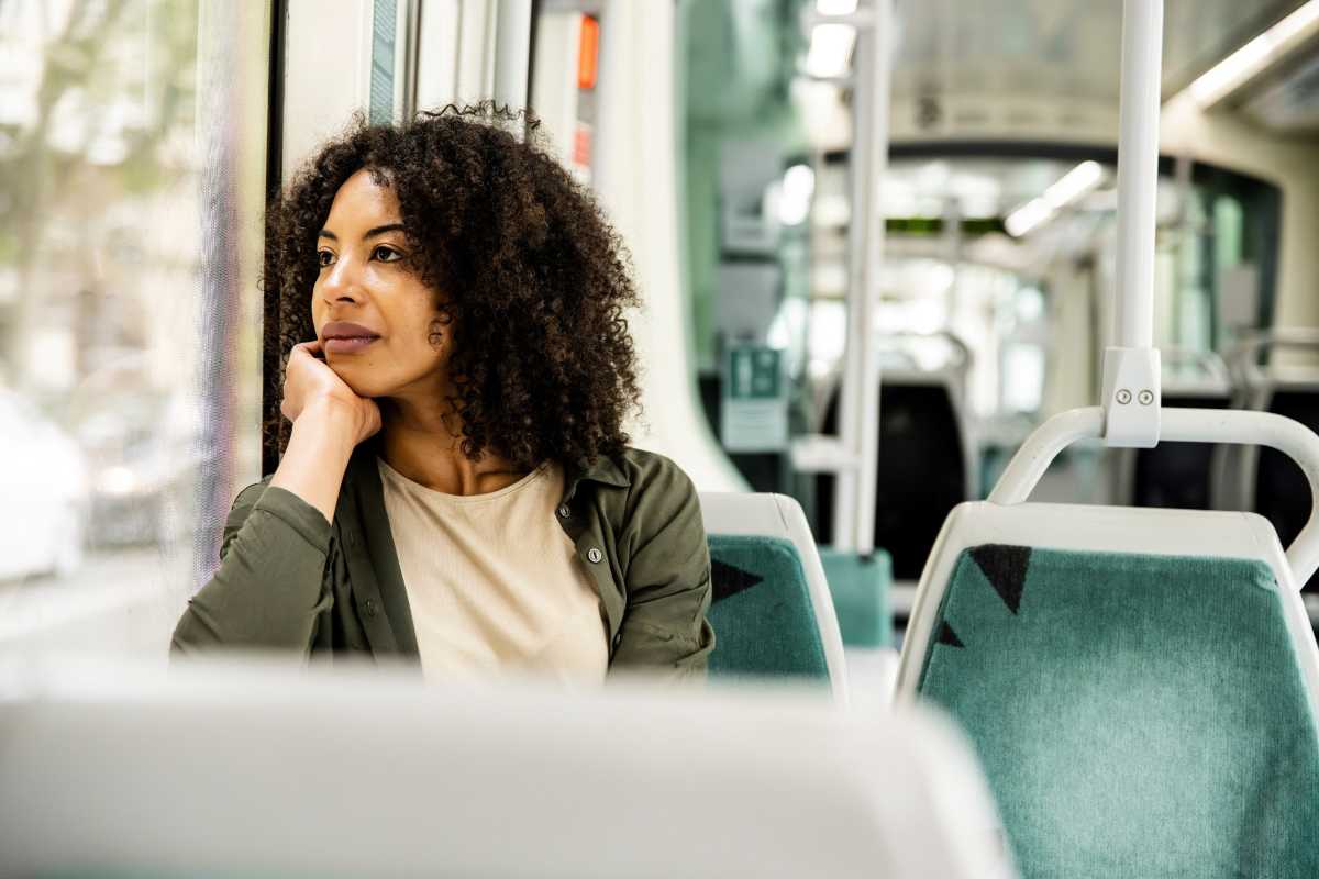 A woman sitting on a bus